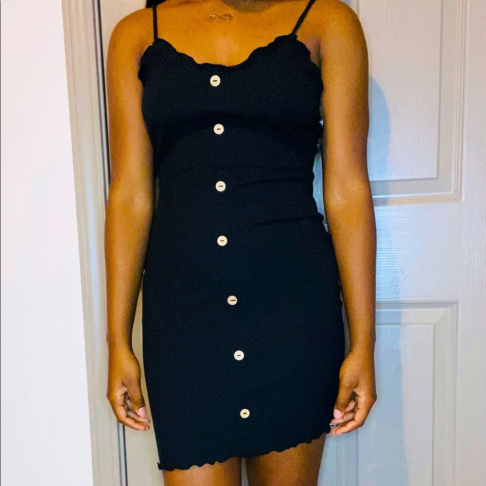 Black and white strappy fitted dresses w/ buttons.